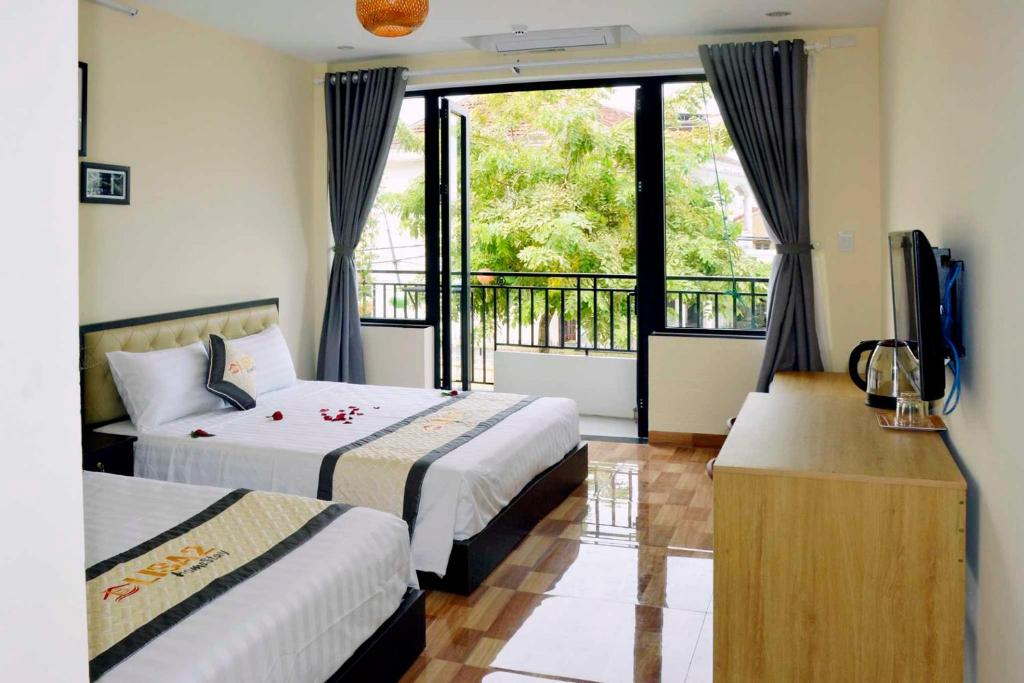 Postel nebo postele na pokoji v ubytování Lisa homestay 2