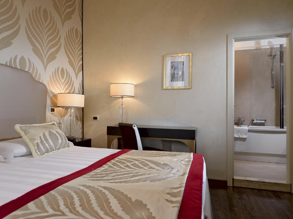 Postel nebo postele na pokoji v ubytování Hotel Principe