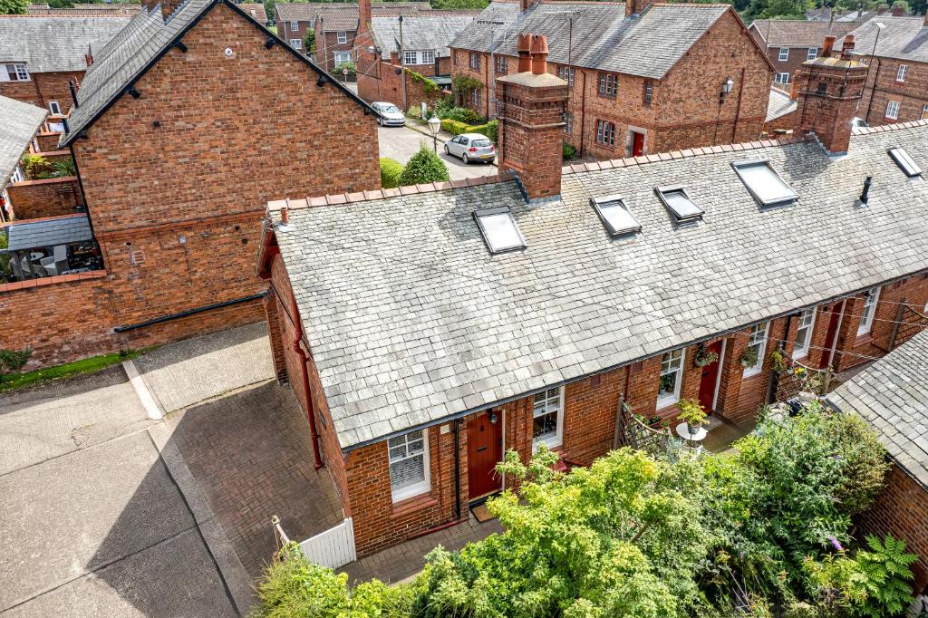 an overhead view of a house with solar panels on the roof at Hidden Gem Hideaway w/ Free Parking in Hough Green