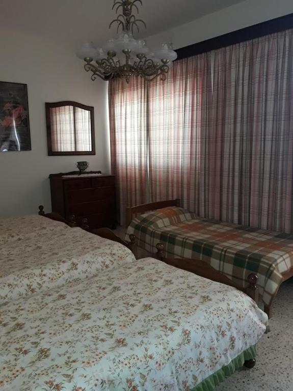 Postel nebo postele na pokoji v ubytování Villa Palma