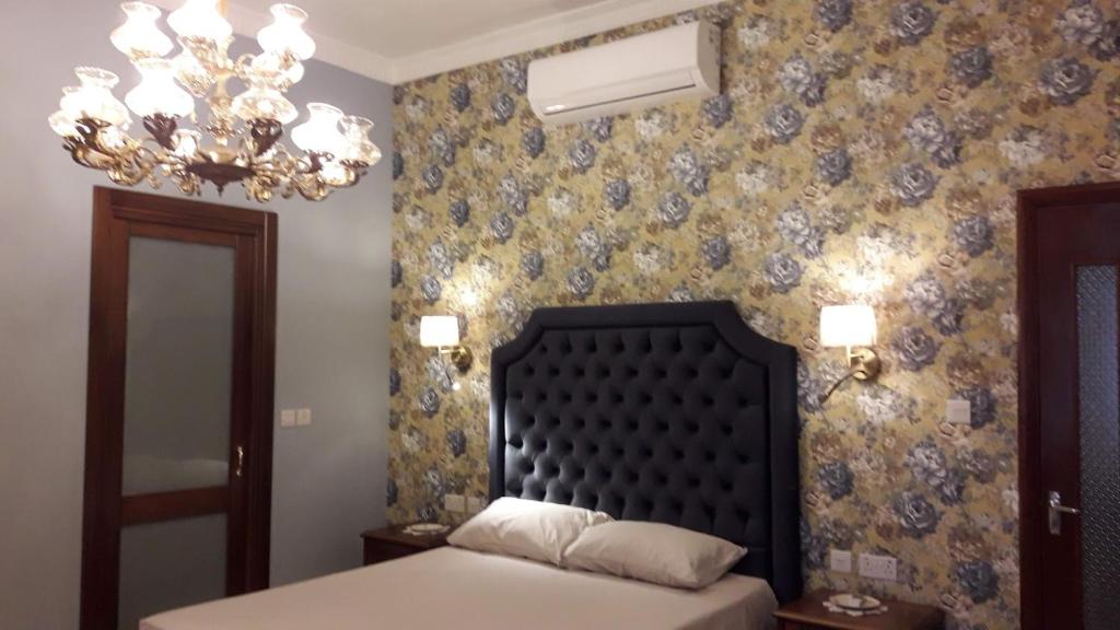 Postel nebo postele na pokoji v ubytování Villa Palma
