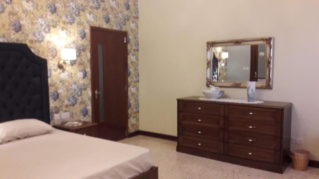 Postel nebo postele na pokoji v ubytování Villa Palma