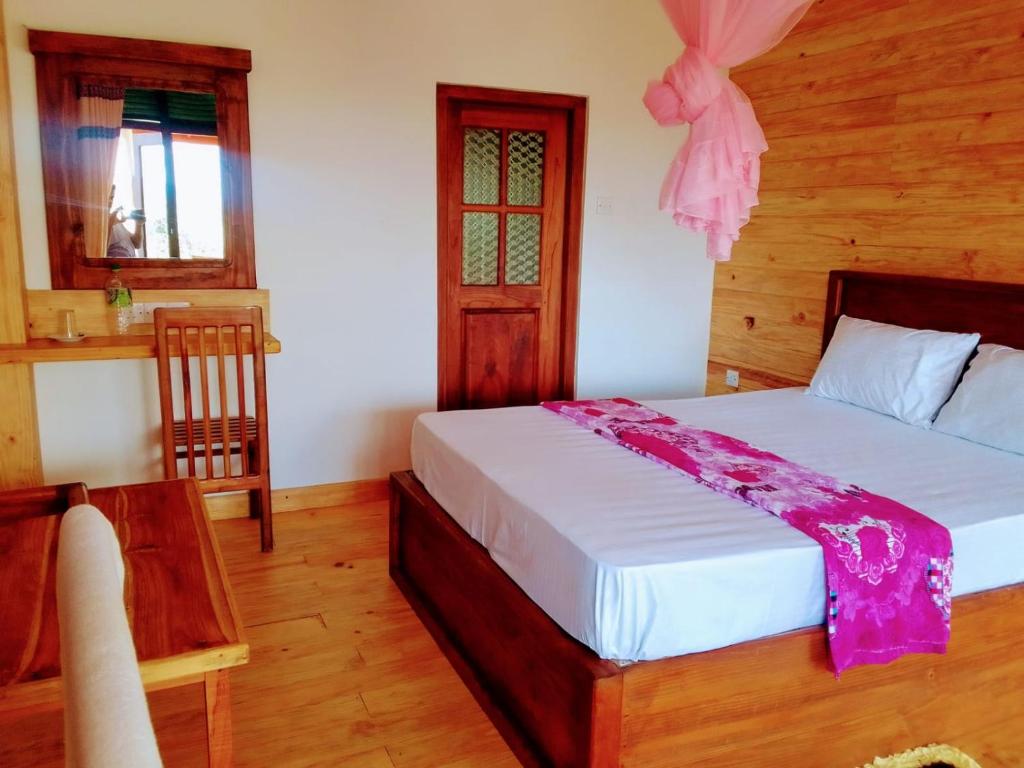 Ein Bett oder Betten in einem Zimmer der Unterkunft Mountain Range Cottage