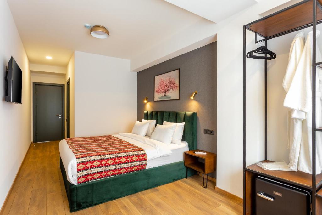 Postel nebo postele na pokoji v ubytování Hotel Flower