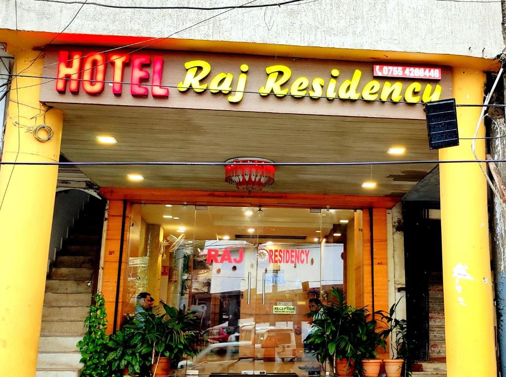 a hotelaja restaurant with a sign on the front of it at Hotel Raj Residency in Bhopal