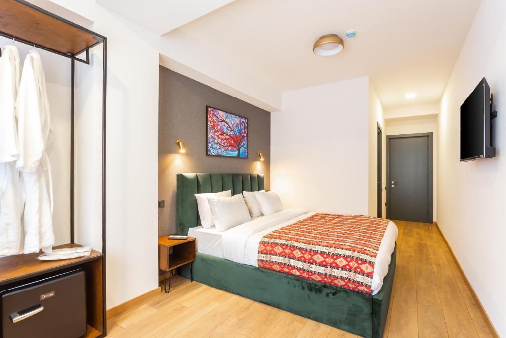 Postel nebo postele na pokoji v ubytování Hotel Flower