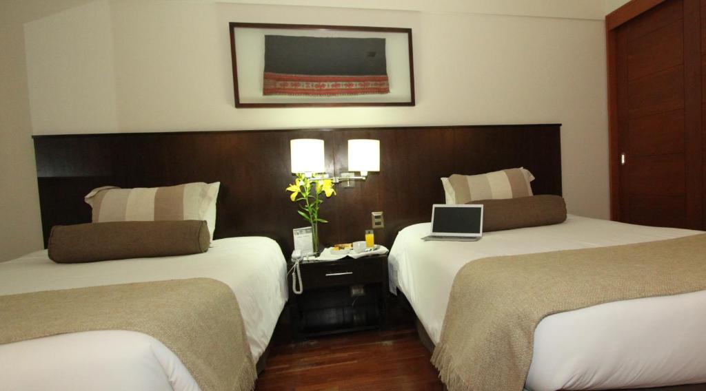 Postel nebo postele na pokoji v ubytování Inca Hoteles
