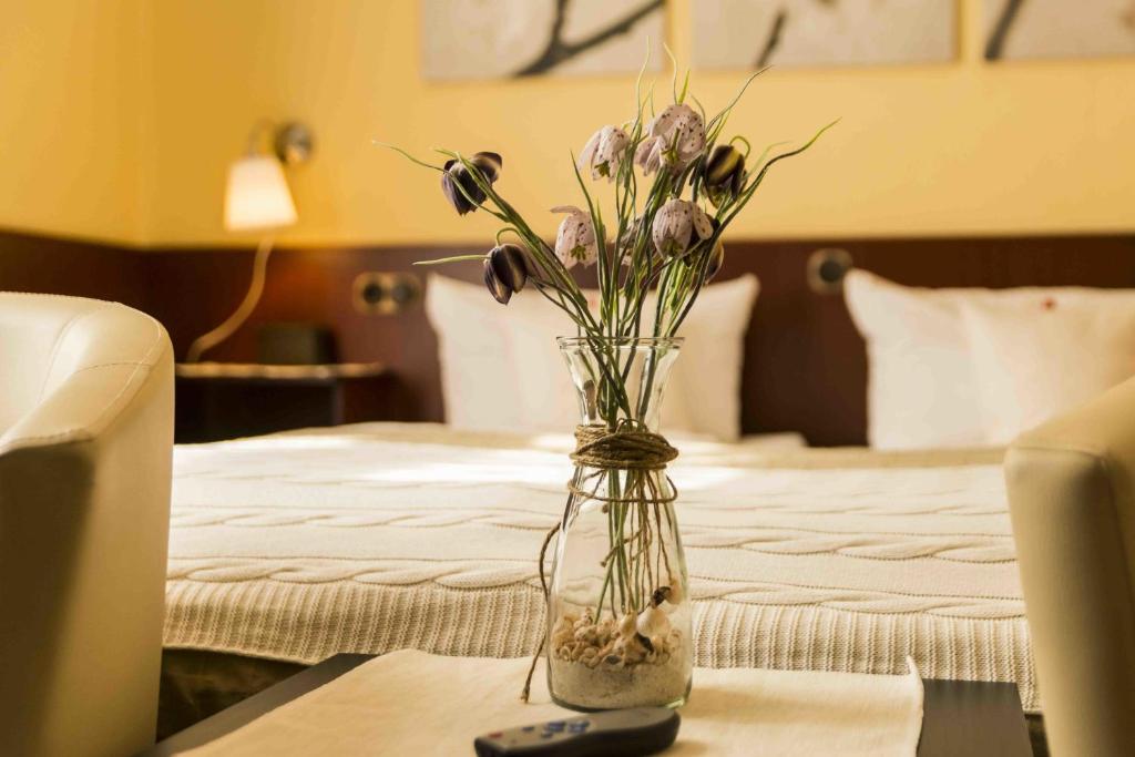 Postel nebo postele na pokoji v ubytování Hotel Hanseatic