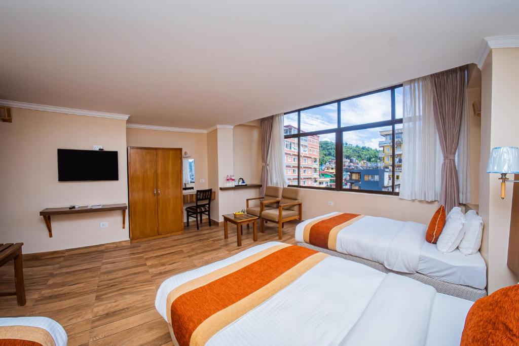 Hotel Fewa Camp客房内的一张或多张床位