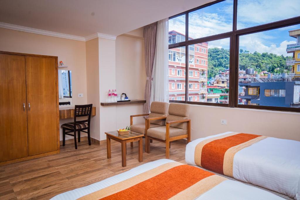 Hotel Fewa Camp客房内的一张或多张床位