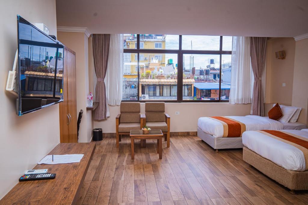 Hotel Fewa Camp客房内的一张或多张床位