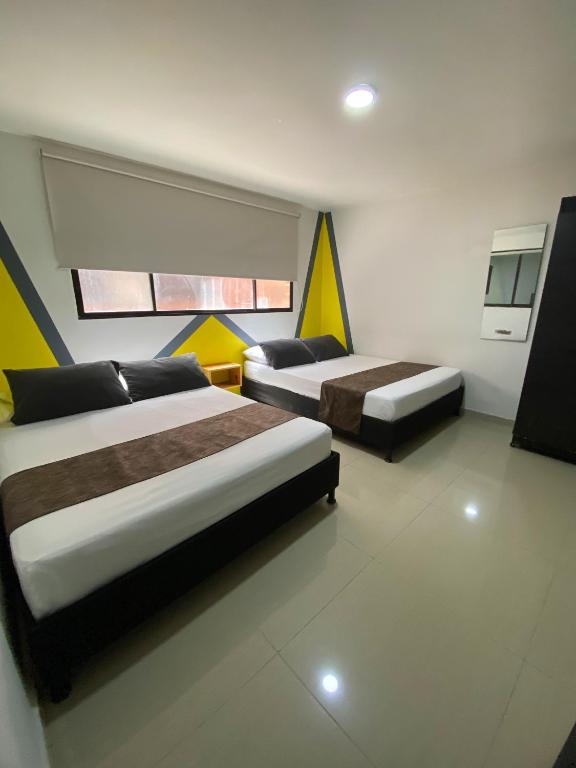 Postel nebo postele na pokoji v ubytování 33 Hotel Bulerias