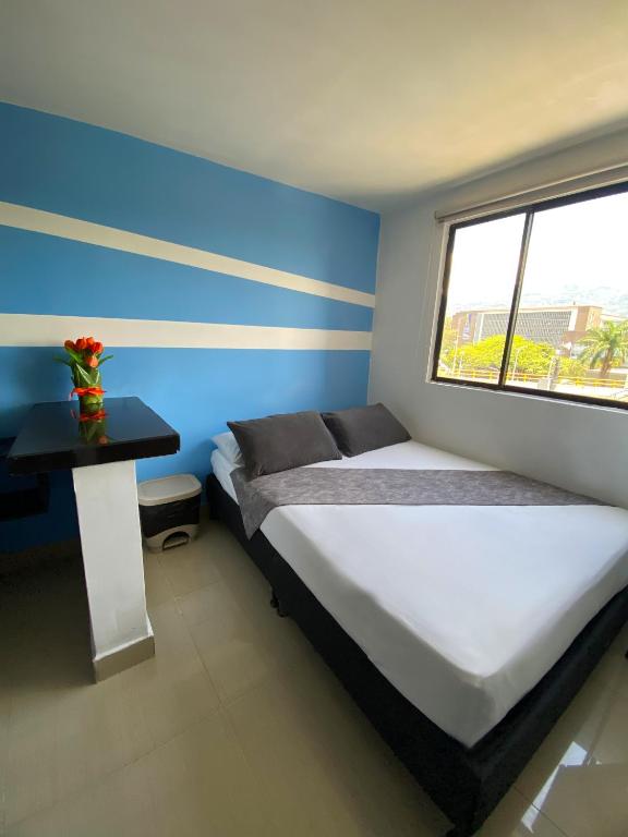 Postel nebo postele na pokoji v ubytování 33 Hotel Bulerias
