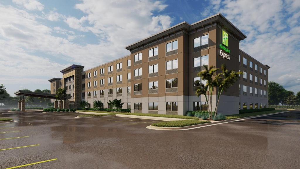 a rendering of an office building with a parking lot at Holiday Inn Express Cape Canaveral, an IHG Hotel in Cape Canaveral