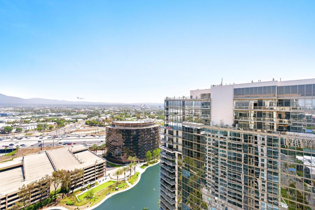 an aerial view of a city with buildings and a river at Oceanview 25th Floor Luxury Penthouse in Santa Ana