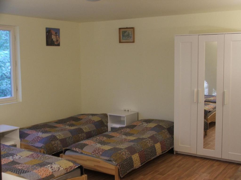 Postel nebo postele na pokoji v ubytování Álomvölgy