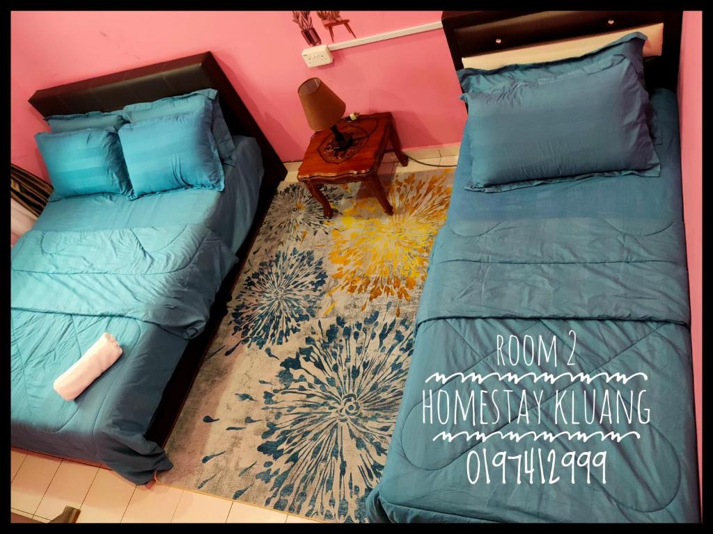A bed or beds in a room at Homestay Tmn Pelangi Jaya 1 kluang free wifi