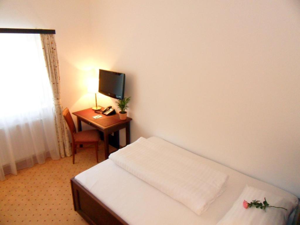 Postel nebo postele na pokoji v ubytování Hotel Gasthof Der Jägerwirt