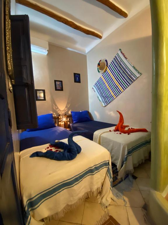 Postel nebo postele na pokoji v ubytování RIAD SULTAN Appart Marrakech