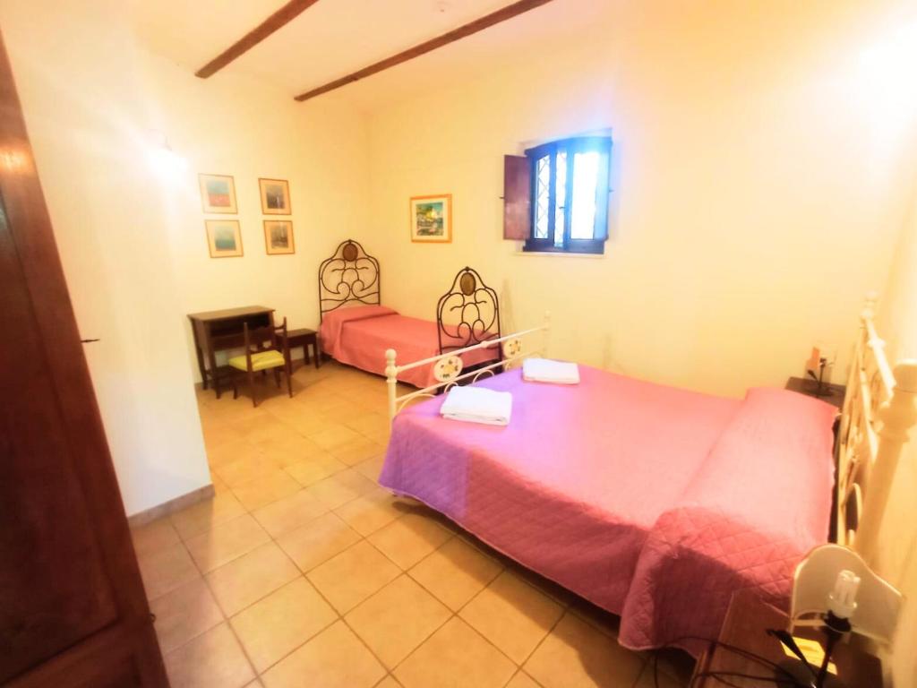 Postel nebo postele na pokoji v ubytování Don Federico Country Inn