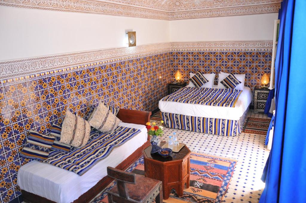 Postel nebo postele na pokoji v ubytování Riad Shaden