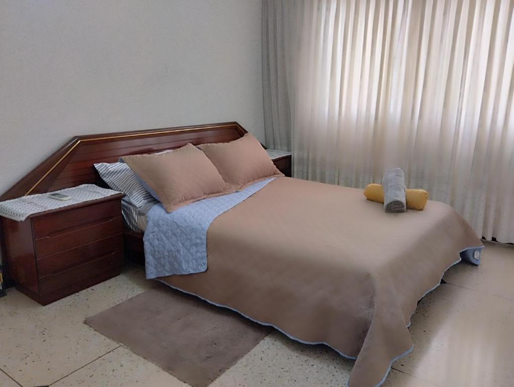 Ліжко або ліжка в номері Apartosuites en Sabana Grande