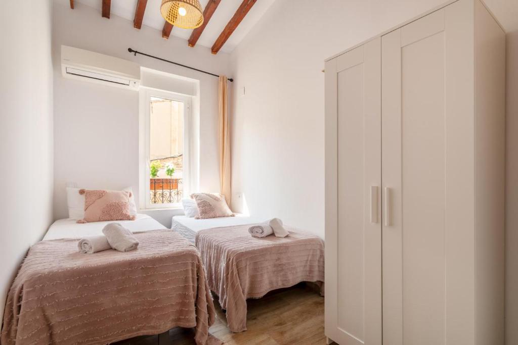Postel nebo postele na pokoji v ubytování Bel appartement rustique au cœur d'Alicante