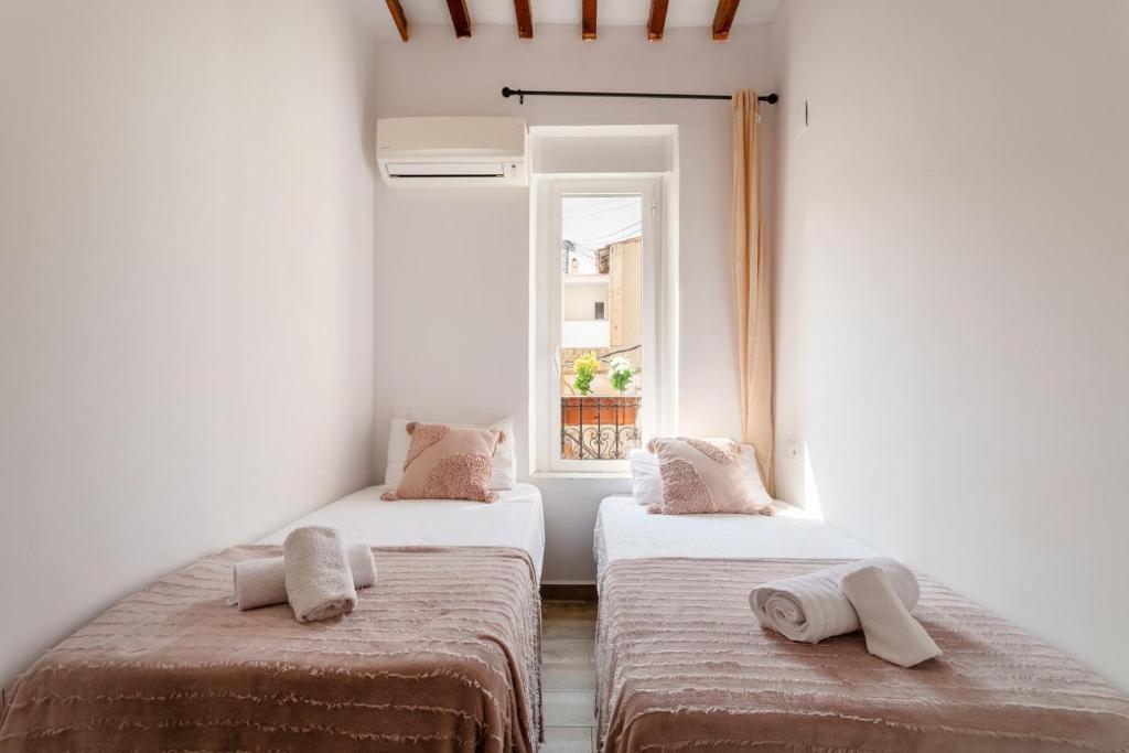Postel nebo postele na pokoji v ubytování Bel appartement rustique au cœur d'Alicante