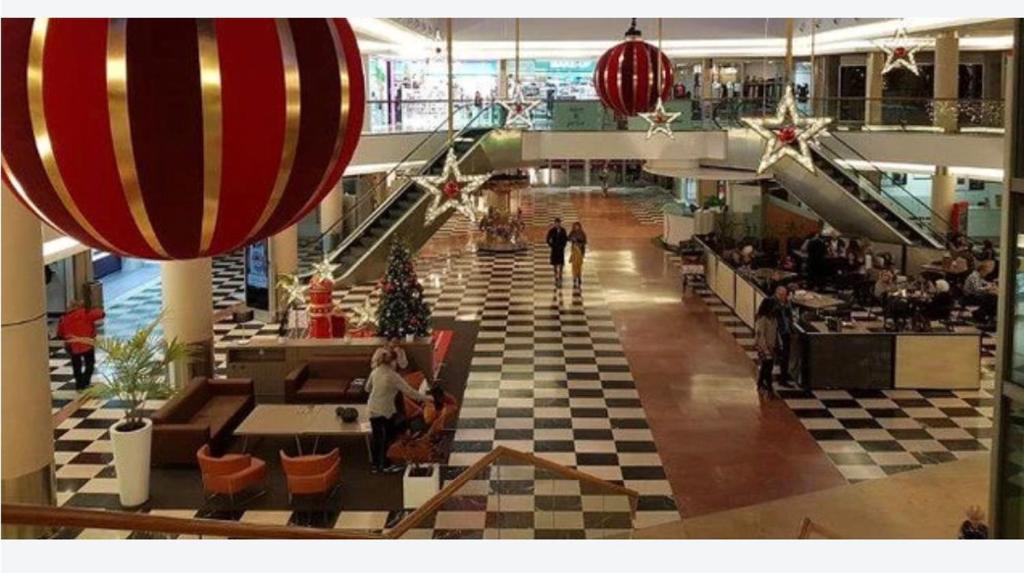 a view of a shopping center with people in a mall at Casa de Mirtha in Madrid