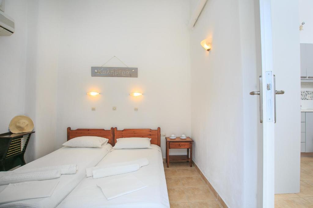 A bed or beds in a room at Paros Rita Studios