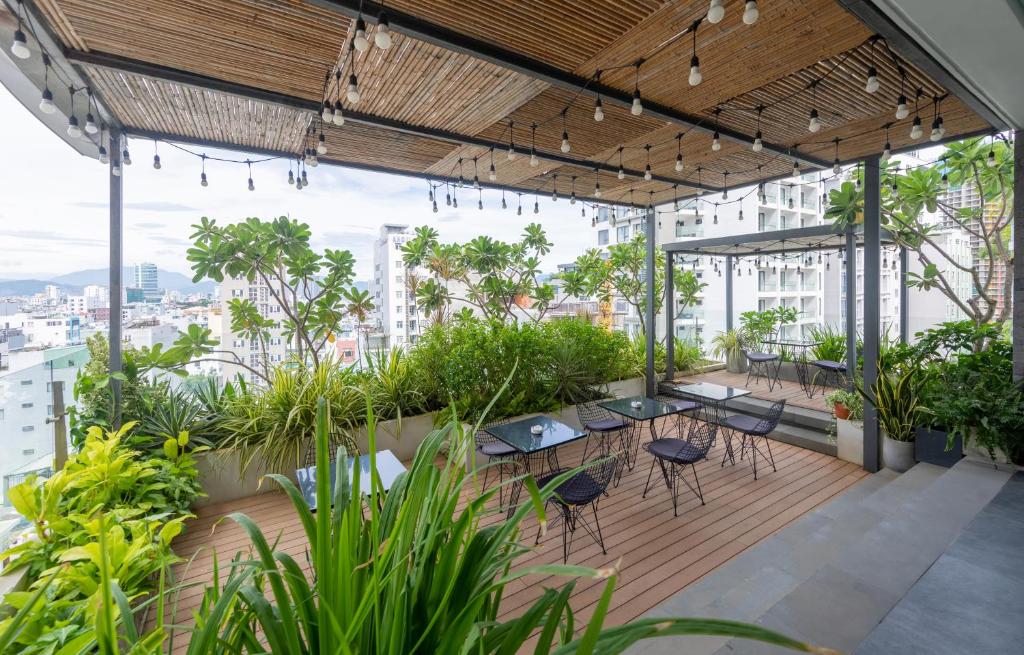 Vrt pred nastanitvijo The Glomad Boutique Danang