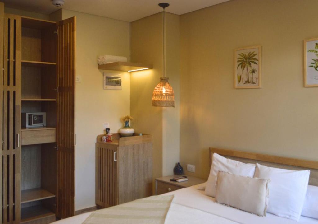 Postel nebo postele na pokoji v ubytování Mythical Hotel Boutique