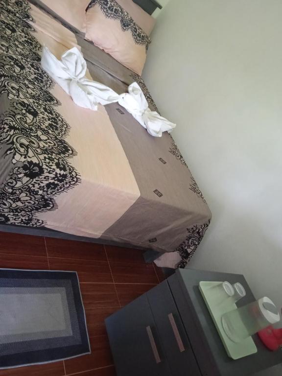 a box sitting on the floor with white flowers on it at Sarah's Garden BnB & Spa SARAHS HOUSE RENTAL in Tontunan