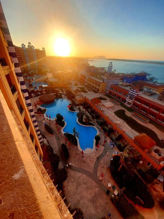 an aerial view of a resort with a pool at Chalet in Porto Marina North Coast in El Alamein