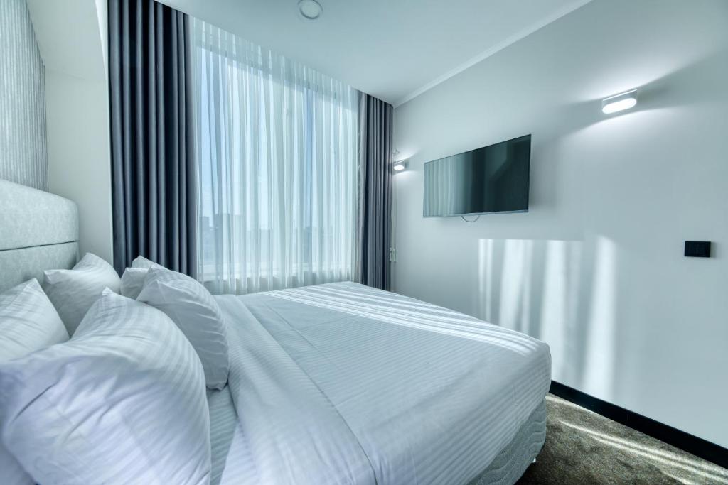 Postel nebo postele na pokoji v ubytování Expocore Hotel