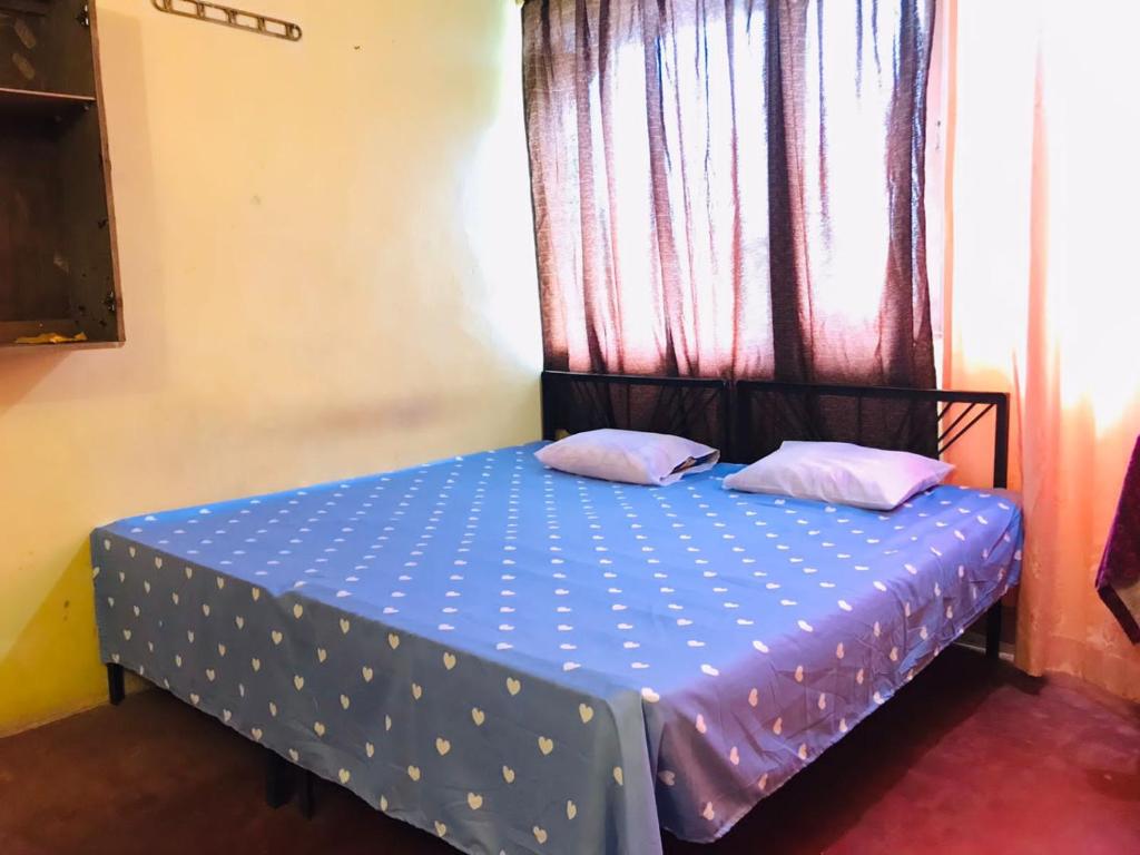 Postel nebo postele na pokoji v ubytování Coca Cola Hostel Malabe
