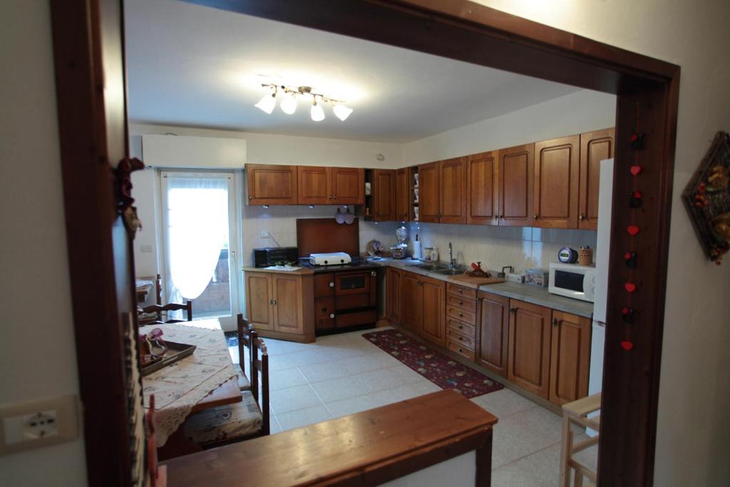 Kuchyň nebo kuchyňský kout v ubytování Casa Noemi Imer