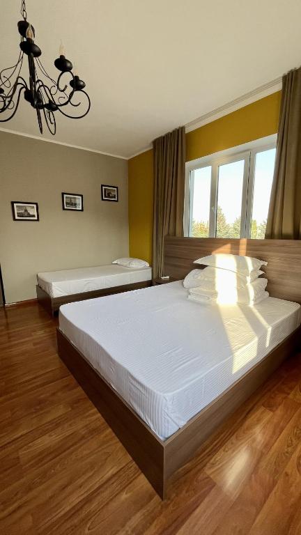 Postel nebo postele na pokoji v ubytování People Guest House