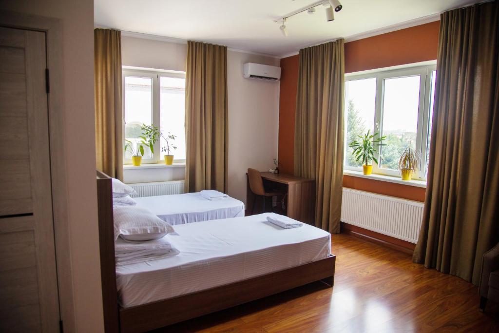 Postel nebo postele na pokoji v ubytování People Guest House