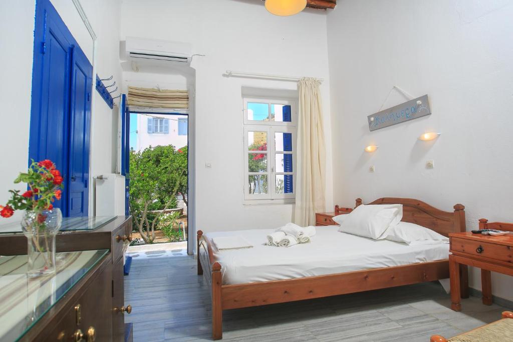 A bed or beds in a room at Paros Rita Studios