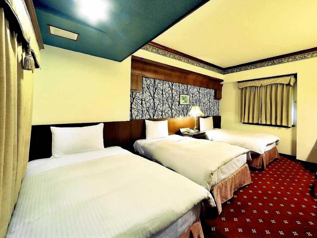 Postel nebo postele na pokoji v ubytování KaRo Hotel