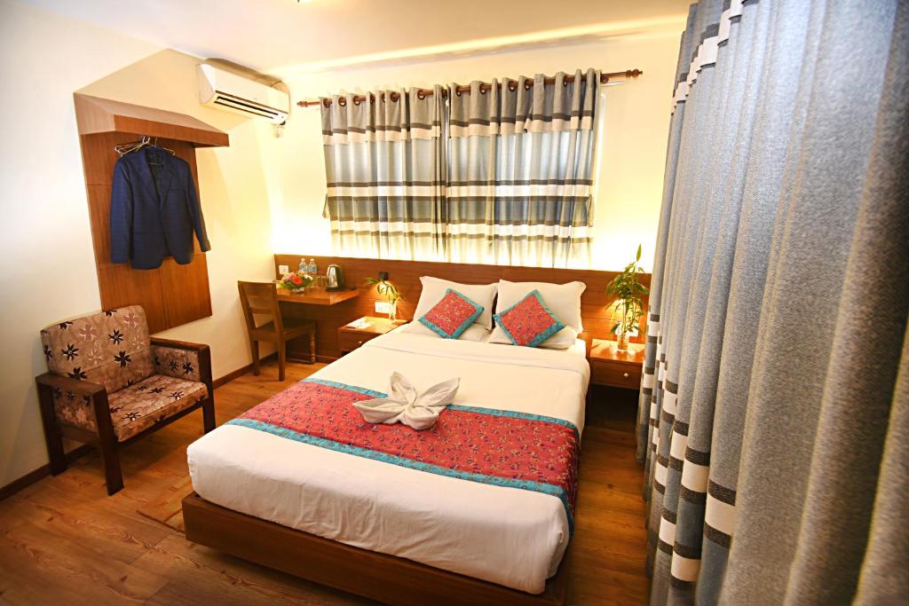 Postel nebo postele na pokoji v ubytování Hotel Amaryllis Kathmandu