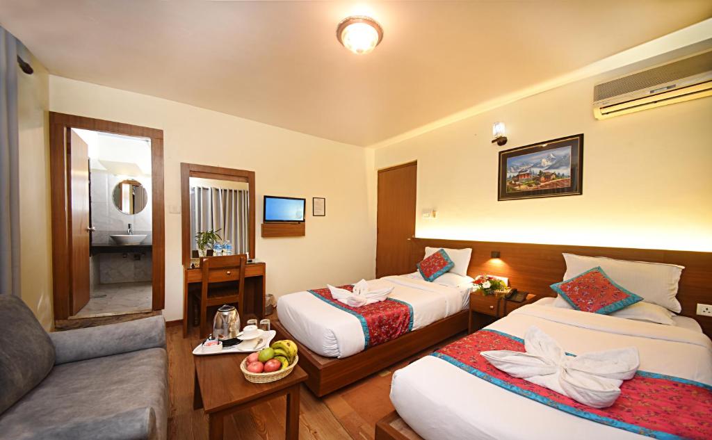 Postel nebo postele na pokoji v ubytování Hotel Amaryllis Kathmandu