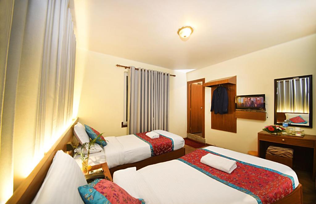 Postel nebo postele na pokoji v ubytování Hotel Amaryllis Kathmandu