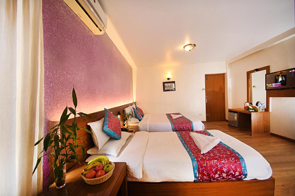 Postel nebo postele na pokoji v ubytování Hotel Amaryllis Kathmandu