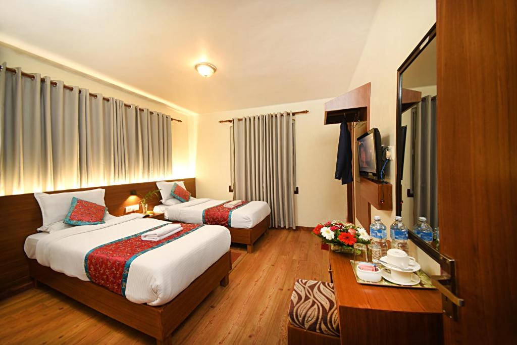 Postel nebo postele na pokoji v ubytování Hotel Amaryllis Kathmandu