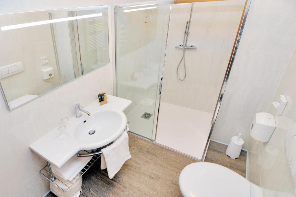 a bathroom with a sink and a shower at Eco Hotel Cleofe in Caorle