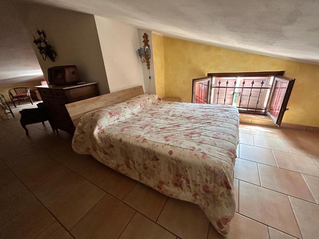 Postel nebo postele na pokoji v ubytování La Perla di Assisi