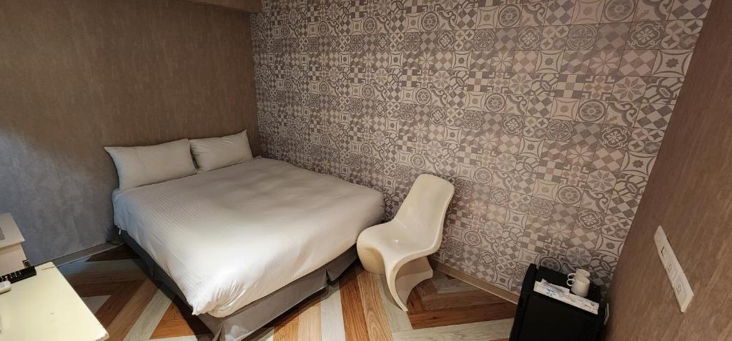 Postel nebo postele na pokoji v ubytování 慶爾喜旅館長沙館Cheers Loft Self Check-in Hotel