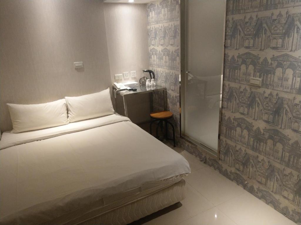 Postel nebo postele na pokoji v ubytování 慶爾喜旅館長沙館Cheers Loft Self Check-in Hotel